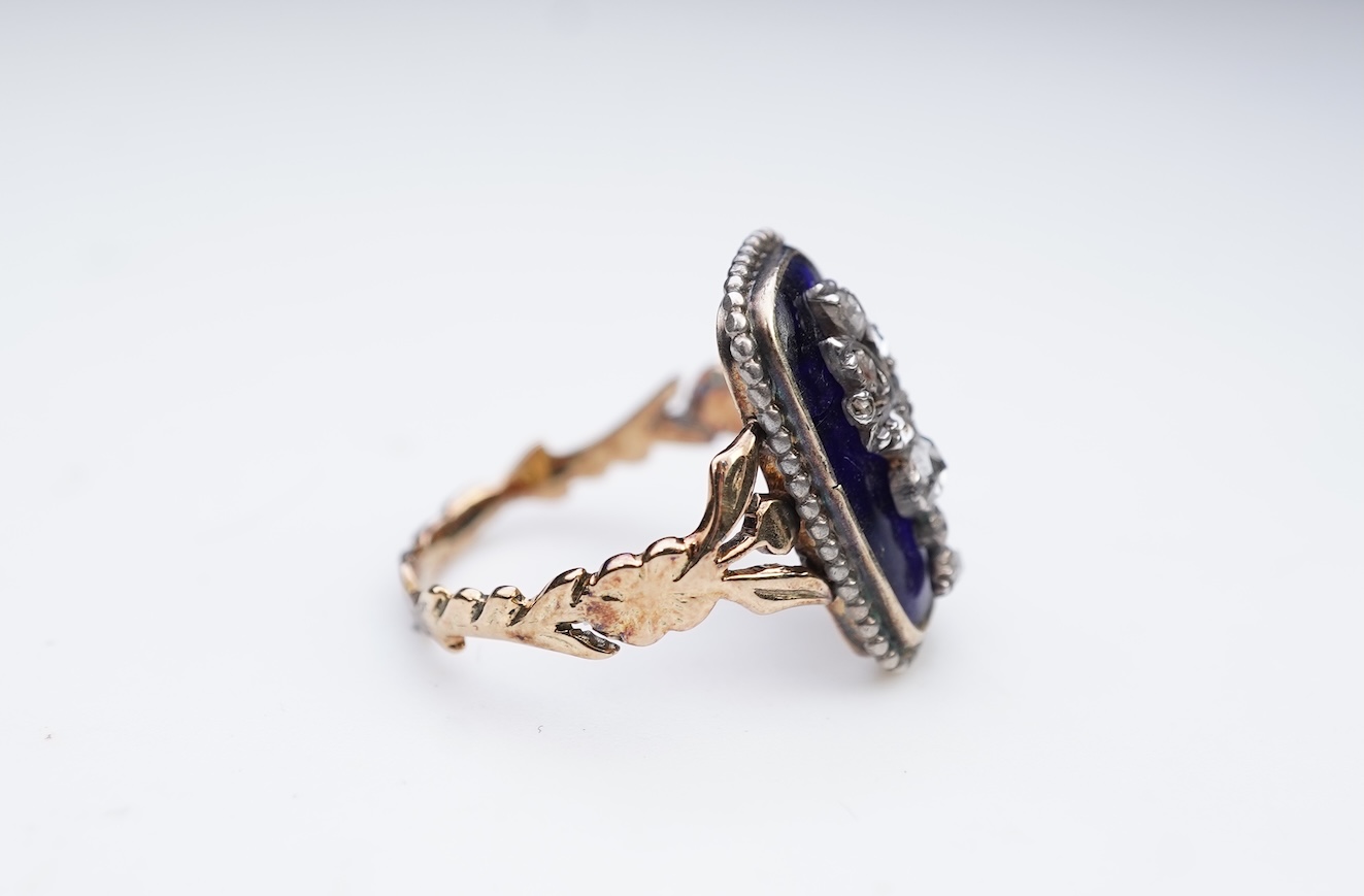 A diamond and blue glass ring
